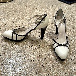 Stuart Weitzman white and black patent leather pump, size 10. Previously worn.